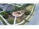 Aerial view of a fenced playground with play equipment, landscaping, and sidewalks at 421 Chayne Pl, St Cloud, FL 34771