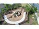 A fenced playground features play equipment with lush landscaping and sidewalk access at 421 Chayne Pl, St Cloud, FL 34771