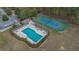 Community amenities including sparkling pool, lounge chairs, and tennis courts offer residents a relaxing atmosphere at 435 Gleneagles Dr, Davenport, FL 33897