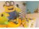 Adorable Minions-themed bedroom with two beds, playful decor, and cozy furnishings at 435 Gleneagles Dr, Davenport, FL 33897