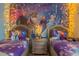Enchanting bedroom featuring Frozen themed decor, mural and twin beds, perfect for children at 435 Gleneagles Dr, Davenport, FL 33897
