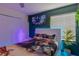 This bedroom boasts an Avatar theme, a plush king-size bed and serene decorative touches at 435 Gleneagles Dr, Davenport, FL 33897