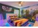 Themed bedroom with a king-size bed, Avatar-themed bedding and murals, plus ambient lighting for ambiance at 435 Gleneagles Dr, Davenport, FL 33897