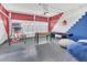 Well-equipped game room with shuffleboard, foosball, basketball game, and comfortable beanbag seating at 435 Gleneagles Dr, Davenport, FL 33897