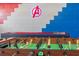 Fun game room with foosball table and colorful superhero-themed wall decor at 435 Gleneagles Dr, Davenport, FL 33897