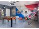 An additional game room includes foosball, a basketball game, and playful wall accents for recreation at 435 Gleneagles Dr, Davenport, FL 33897