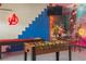 Fun recreational space with shuffleboard, foosball table, and custom wall art at 435 Gleneagles Dr, Davenport, FL 33897