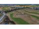 Expansive aerial view of the lush green golf course with sand traps and manicured fairways at 435 Gleneagles Dr, Davenport, FL 33897