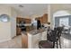 Stylish kitchen with granite countertops, stainless steel appliances, and eat-in breakfast bar at 435 Gleneagles Dr, Davenport, FL 33897