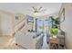 Relaxing Gathering living area featuring plush sofas, neutral colors, and an outdoor pool view at 435 Gleneagles Dr, Davenport, FL 33897