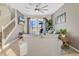 A large, bright living room with a view of the pool at 435 Gleneagles Dr, Davenport, FL 33897