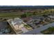 Aerial shot of neighborhood showcasing single-Gathering homes, well-maintained lawns, and views of the golf course at 435 Gleneagles Dr, Davenport, FL 33897
