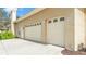 Attached two-car garage with driveway at 5345 Bloomfield Blvd, Lakeland, FL 33810