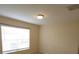Bedroom featuring a large window providing natural light and neutral carpeting at 5407 Quarry Rock Rd, Lakeland, FL 33809