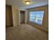 Bedroom featuring a window, carpet, and closet at 5407 Quarry Rock Rd, Lakeland, FL 33809