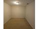 Bedroom featuring neutral carpeting, walls and a ceiling light at 5407 Quarry Rock Rd, Lakeland, FL 33809