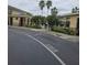 Community pool featuring palm trees, an access gate, and manicured landscaping at 5407 Quarry Rock Rd, Lakeland, FL 33809