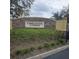Cobblestone Landing community sign with stone base and lush landscaping at 5407 Quarry Rock Rd, Lakeland, FL 33809