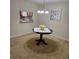 Cozy dining area featuring a dark wood table, chandelier lighting, and a view into the kitchen at 5407 Quarry Rock Rd, Lakeland, FL 33809
