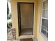A view of the entryway with tile flooring and a glimpse of the interior at 5407 Quarry Rock Rd, Lakeland, FL 33809