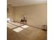 Bright living room with beige carpeting, natural light, and tasteful decor creating a welcoming space at 5407 Quarry Rock Rd, Lakeland, FL 33809