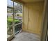 Patio featuring an exterior utility door and a view of greenery at 5407 Quarry Rock Rd, Lakeland, FL 33809