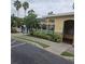Community pool area with a gated entrance, palm trees and landscaping at 5407 Quarry Rock Rd, Lakeland, FL 33809