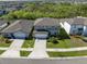 Aerial view of a well-maintained home with a driveway and landscaped yard at 5531 Keaton Springs Dr, Lakeland, FL 33811