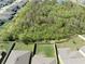 Aerial view of a property with a fenced backyard backing onto wooded area at 5531 Keaton Springs Dr, Lakeland, FL 33811