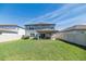 Spacious fenced backyard with a covered patio, perfect for outdoor enjoyment at 5531 Keaton Springs Dr, Lakeland, FL 33811