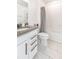Modern bathroom with sleek vanity, subway tile shower, and gray tile floor at 5531 Keaton Springs Dr, Lakeland, FL 33811