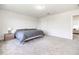 Relaxing bedroom featuring gray carpet, white walls, two windows and a comfortable bed at 5531 Keaton Springs Dr, Lakeland, FL 33811