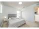 Cozy bedroom with plush carpet, neutral tones, and a queen bed at 5531 Keaton Springs Dr, Lakeland, FL 33811