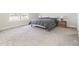 Relaxing bedroom featuring gray carpet, white walls, two windows and a comfortable bed at 5531 Keaton Springs Dr, Lakeland, FL 33811
