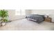 Relaxing bedroom featuring gray carpet, white walls, two windows and a comfortable bed at 5531 Keaton Springs Dr, Lakeland, FL 33811