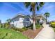 Charming clubhouse featuring stone accents, a covered entryway, and lush landscaping for a welcoming ambiance at 5531 Keaton Springs Dr, Lakeland, FL 33811