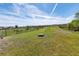Spacious, fenced dog park with various play structures and seating, providing a fun and secure environment for pets at 5531 Keaton Springs Dr, Lakeland, FL 33811
