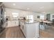 Modern kitchen open to the dining area, featuring stainless appliances and a large kitchen island at 5531 Keaton Springs Dr, Lakeland, FL 33811