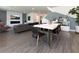 Stylish living space with modern dining table, gray sofa, and sleek entertainment center at 5531 Keaton Springs Dr, Lakeland, FL 33811