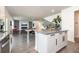 Open living area with modern kitchen island, dining area, and comfortable seating at 5531 Keaton Springs Dr, Lakeland, FL 33811