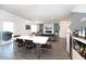 Open floor plan features dining area, modern lighting, and a view of the living area at 5531 Keaton Springs Dr, Lakeland, FL 33811