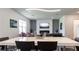 The living space features a modern fireplace, gray sofa, and sleek dining table at 5531 Keaton Springs Dr, Lakeland, FL 33811