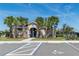 Community pool with covered pavilion, palm trees, and bicycle rack at 5531 Keaton Springs Dr, Lakeland, FL 33811