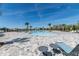 Expansive community pool with a zero entry zone and luxurious lounging areas at 5531 Keaton Springs Dr, Lakeland, FL 33811