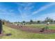 Outdoor workout area with green exercise equipment and well-maintained landscaping for community fitness at 5531 Keaton Springs Dr, Lakeland, FL 33811