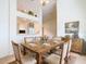 Bright dining room featuring a rustic wood table with seating for six, perfect for Gathering meals at 5639 Water Oak Ln, Mulberry, FL 33860