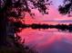 Gorgeous sunset reflecting on the lake at 5639 Water Oak Ln, Mulberry, FL 33860