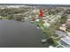 Aerial view highlights the home's proximity to the lake and surrounding neighborhood amenities via canal access at 5716 Gibson Shores Dr, Lakeland, FL 33809