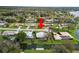 Aerial view of a home with water access on a canal and lake at 5716 Gibson Shores Dr, Lakeland, FL 33809