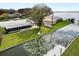 Waterfront homes with private docks and lush landscaping and a serene backyard at 5716 Gibson Shores Dr, Lakeland, FL 33809